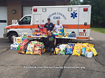Ritchie County Ambulance Authority employees help with a donation event for the Ritchie Co. Humane Society.